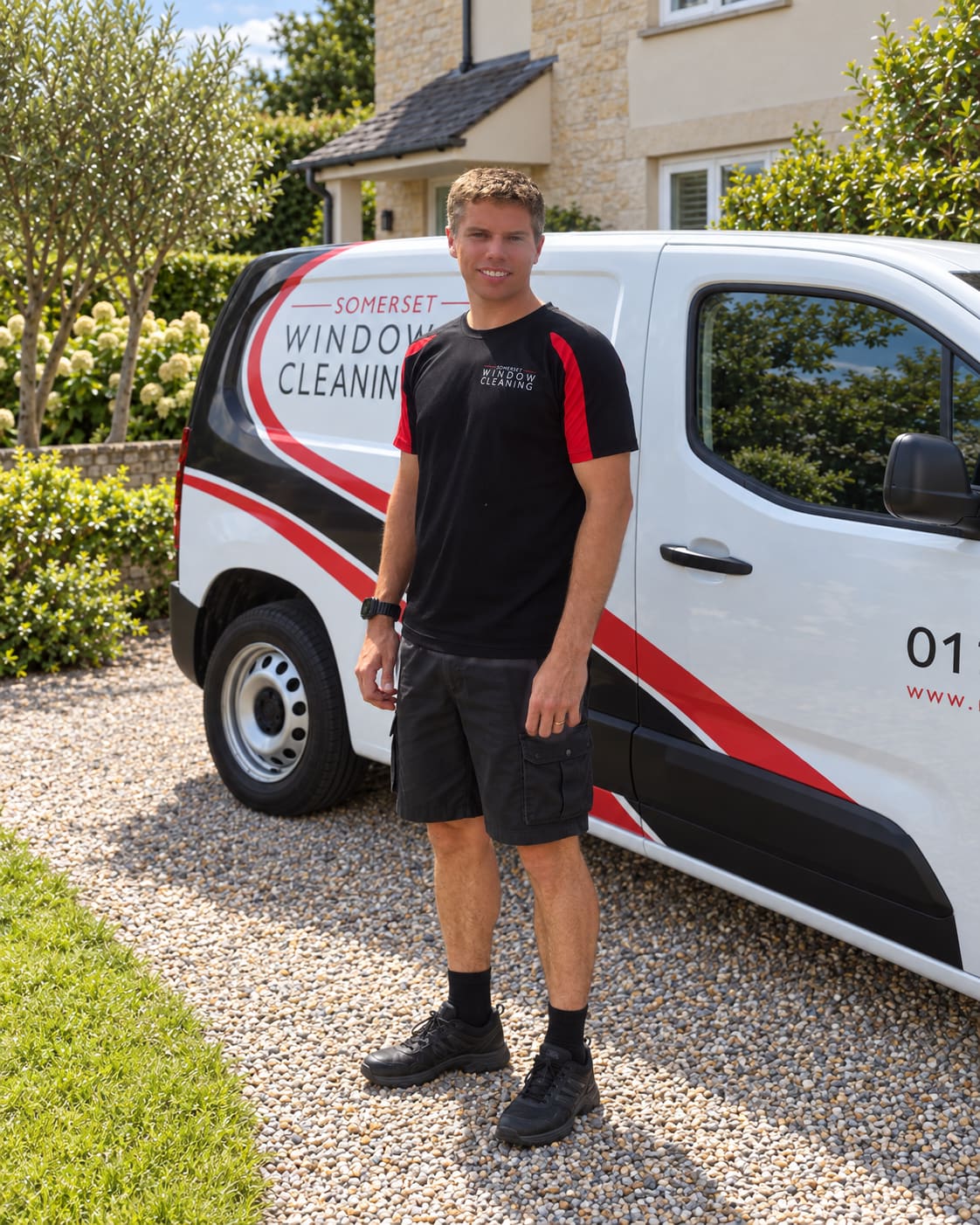 Dan, the owner and founder, beside a Somerset Window Cleaning van; edited full-length portrait